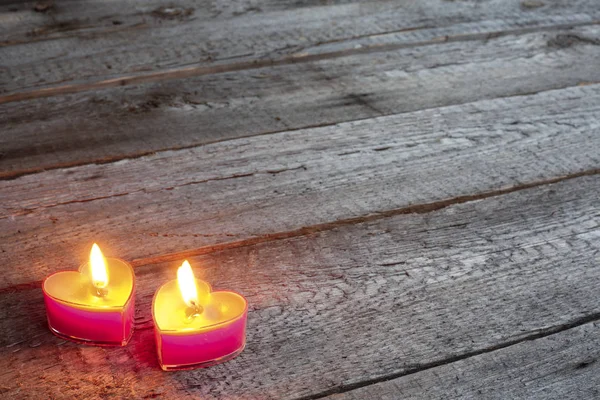 Heart Shaped Candles Burning Wooden Background Valentines Day Concept — Stock Photo, Image