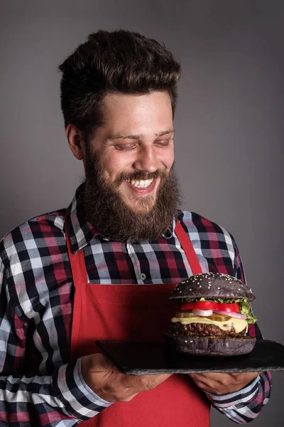 Male Cook Red Apron Giving You Fresh Self Made Black — Stock Photo, Image