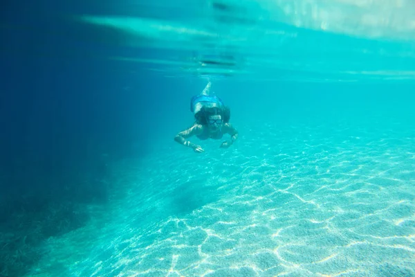 Woman diving swimming underwater view