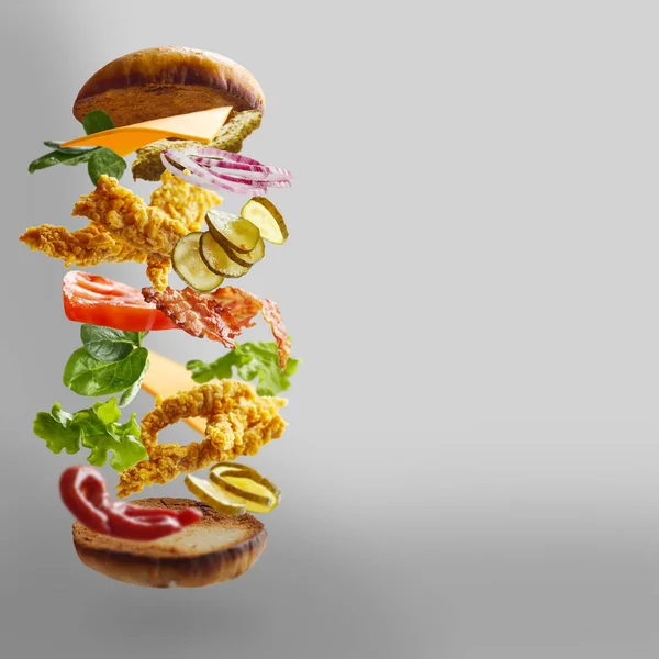 Chickenburger with flying ingredients
