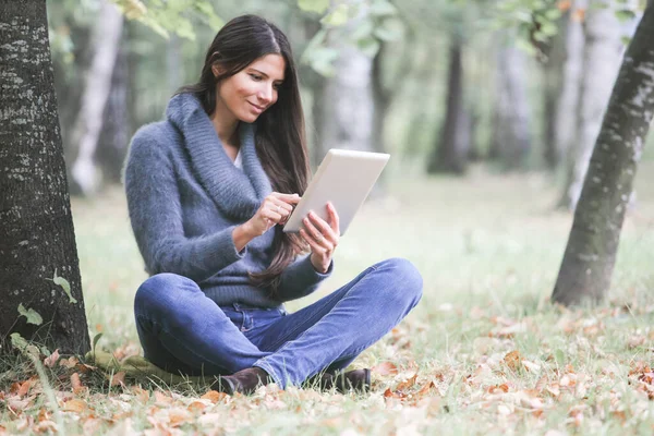 Smiling Young Woman Using Digital Tablet Sitting Autumn Park — Stock Photo, Image