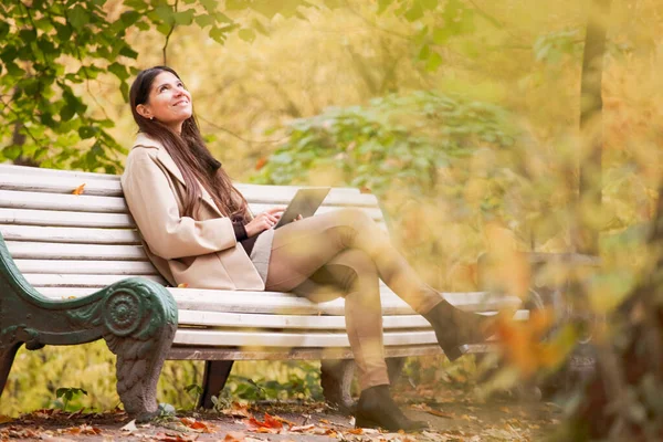 Smiling Young Woman Using Digital Tablet Sitting Autumn Park — Stock Photo, Image