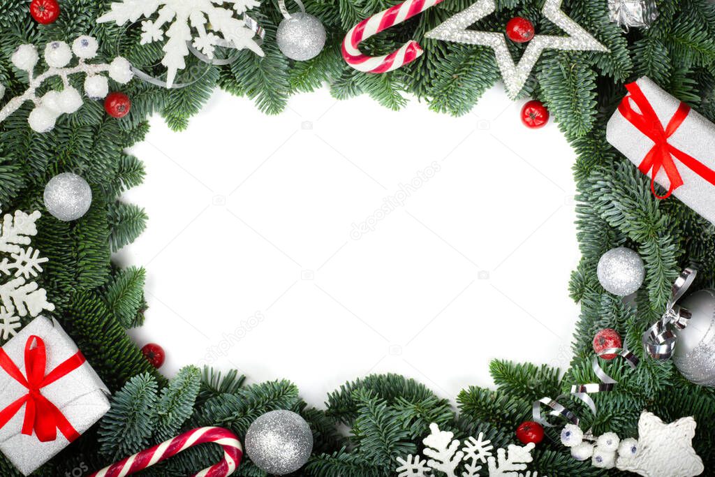 Christmas design boder frame greeting card of noble fir tree branches gifts and silver baubles isolated on white background