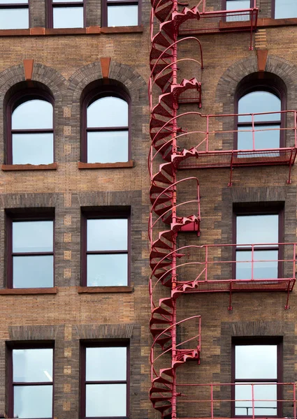 Red emergency stairway outside a vintage building in Minnesota