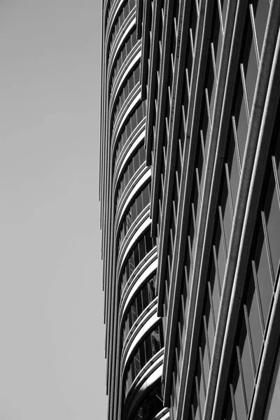 Photograph of a profile of two buildings side to side in black and white