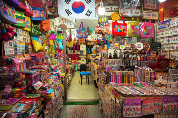 Colorful stand with bags, purse and souvenirs for sale into a Namdaemun Market in South Korea.  It is the oldest and largest market in Korea.