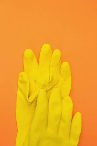 Guantes Goma Amarillos Sobre Fondo Naranja —  Fotos de Stock