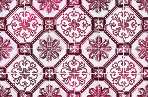 Photograph of traditional portuguese tiles in red and burgundy