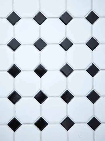 White mat tiles on a wall with grey cement — Stock Photo, Image