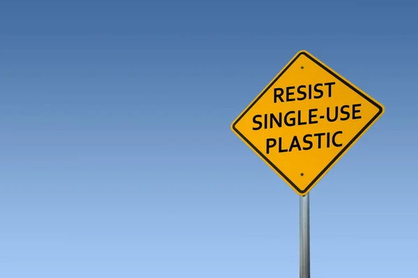 Environmental Sign Posts Against A Blue Sky Background