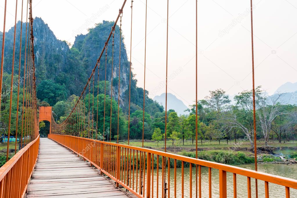 Orange bridge over song river Landmark in Vang Vieng,Laos 