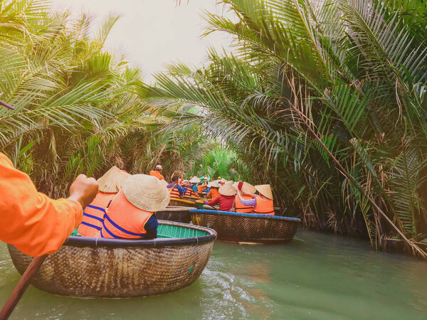 Tourists riding bamboo basket boats in Hoi An,vietnam