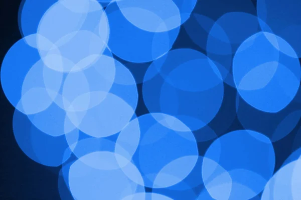 Blue circles of light abstract background. Bokeh background