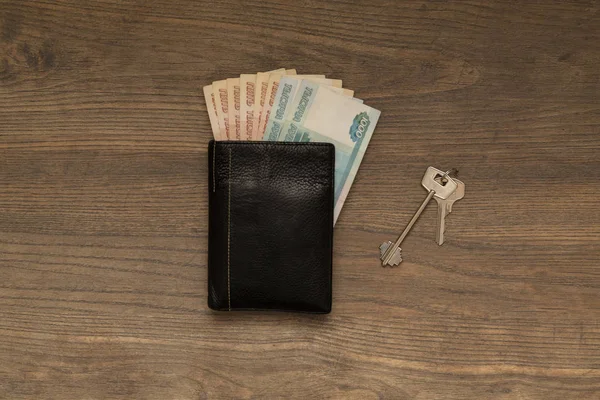 Cash in wallet on wooden background, russians money, finance concept