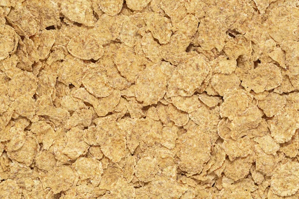 Cereal flakes background and texture, cereal flakes for morning breakfast. Top view.