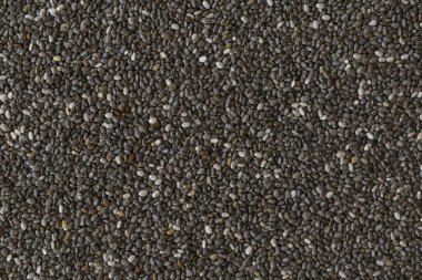 Doku arka plan olarak Chia tohumları. Sağlıklı süper yiyecekler. Chia tohumlarının yakın çekim, metin için alan. 