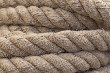 Endüstriyel halat. Arka plan olarak yakın çekim ip - doku. Deniz ipi. Yıpranmış bir tekne halatının yakın çekim. Deniz arka planı.