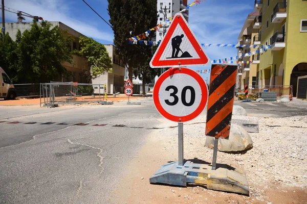 Roadwork and speed limit traffic signs in Yehud - small city in central Israel. — Stock Image Roadwork Speed Limit Traffic Signs Yehud Small City Central Israel Royalty Free Stock Images