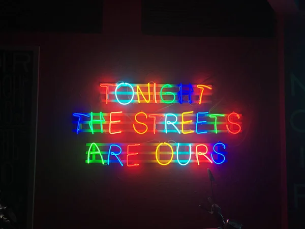 Glowing neon city lights that read \