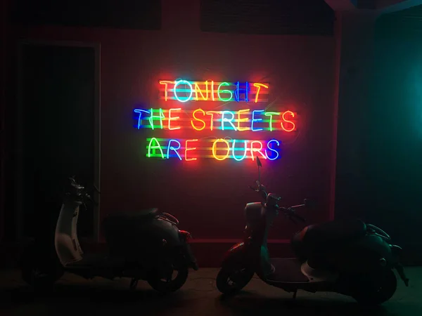 Glowing neon city lights that read \