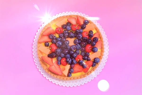 Crostata with berries and fruits on the rose coloured bacground, view from above