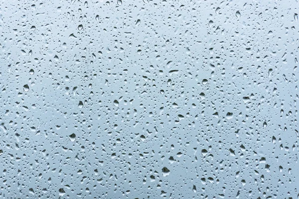 Hintergrund von Wasser mit Wassertropfen auf Glas — Stockfoto