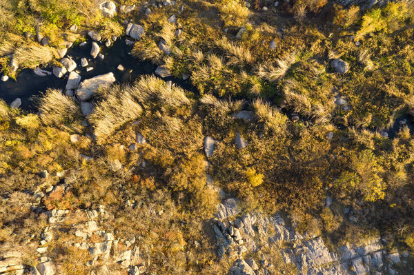 Rocky place with river. Top view. Canyon. Aero photo shooting. Stone background