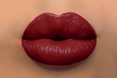 Human kiss lips with glamorous glossy wine red lipstick on the face of an attractive beautiful woman as a beauty and health concept pertaining to cosmetics and female business fashion clipart