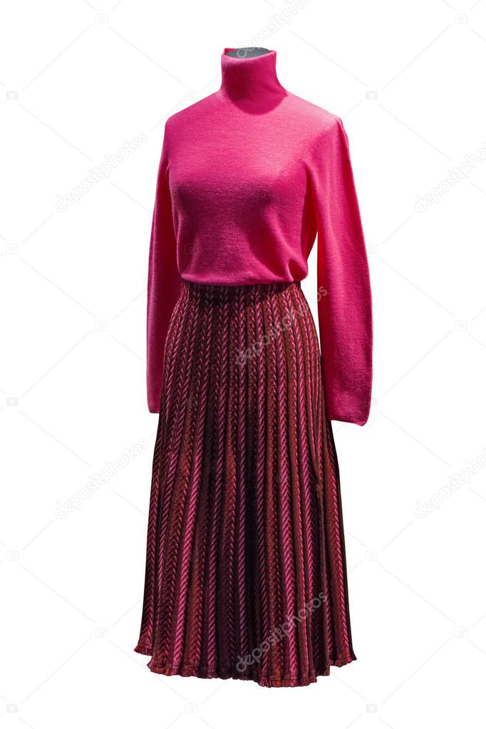 Stylish female crimson turtleneck and striped long skirt on mannequin. Female autumn outfit
