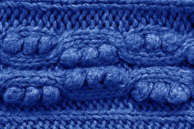 Örme doku. Yünden kumaş. Arka plan kopya alanı. Yün desen, mavi renkli örgü el işi kazak doku