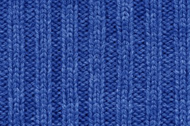 Örme doku. Yünden kumaş. Arka plan kopya alanı. Yün desen, mavi renkli örgü el işi kazak doku