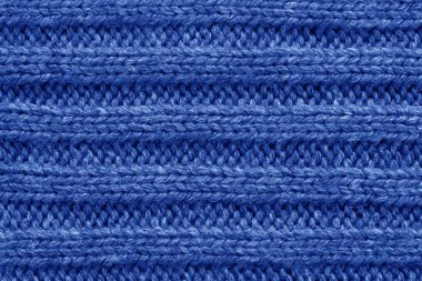 Örme doku. Yünden kumaş. Arka plan kopya alanı. Yün desen, mavi renkli örgü el işi kazak doku