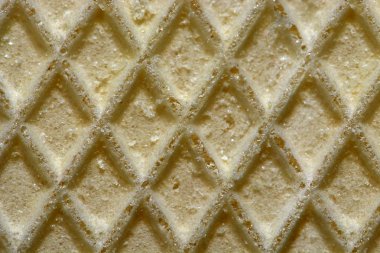 Waffle yüzey aşırı makro. Gofret dokusu, gıda arka plan, soyut dikişsiz desen