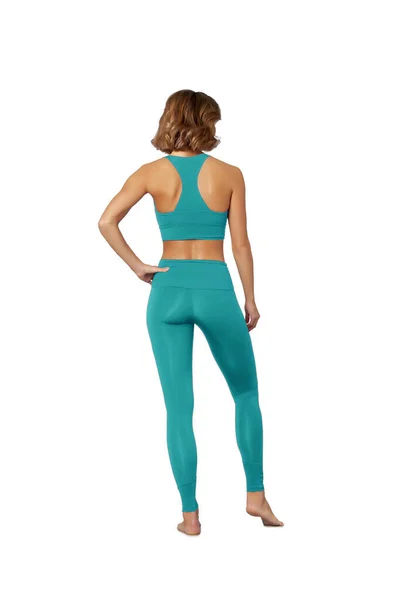 Fitness Meisje Turquoise Sweatsuit Met Perfecte Figuur Staat Blootsvoets Geïsoleerd — Stockfoto