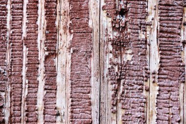 Ahşap bir yüzey üzerinde eski soyma boya. kırmızı boya boyalı retro duvar arka plan