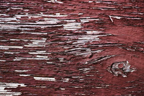 Régi peeling festéket egy fából készült felületre. háttere retro fal festett vörös festékkel — Stock Fotó