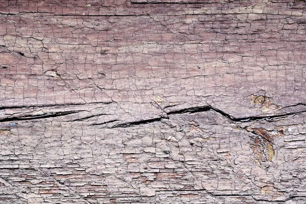 Стара пілінгова фарба на дерев'яній поверхні. фон ретро стіни пофарбований в червону фарбу — стокове фото