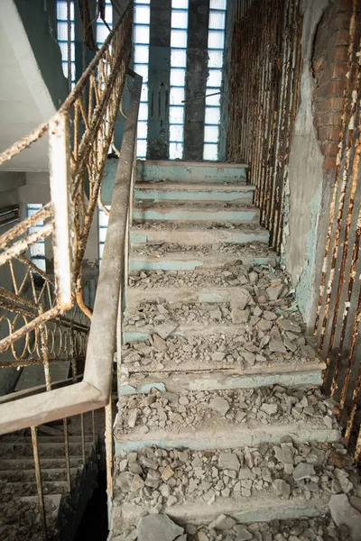 Empty old stairs in abandoned building at Chernobyl