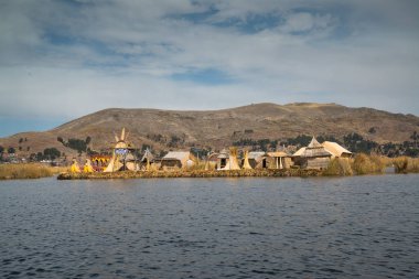Puno, Peru, circa september 2017: floating Islands Los Uros of lake Titicaca Puno, Peru, South America  clipart