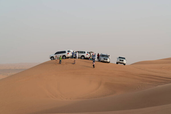 DUBAI - JUNE 17, 2014 - Dune bashing on Arabian desert near Dubai, United Arab Emirates