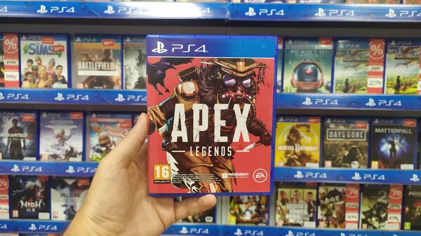 Bratislava, Slovakia, october 13, 2019: Man holding Apex Legends videogame on Sony Playstation 4 console in store