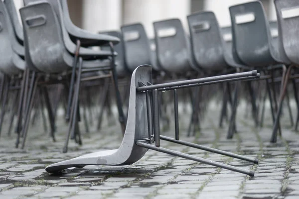 Empty Wet Plastic Chairs Outdoors Rainy Day Focus One Fallen — Stock Photo, Image