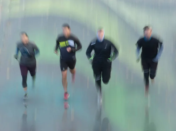 Four Jogging Men Row Reflection Floor — Stock Photo, Image