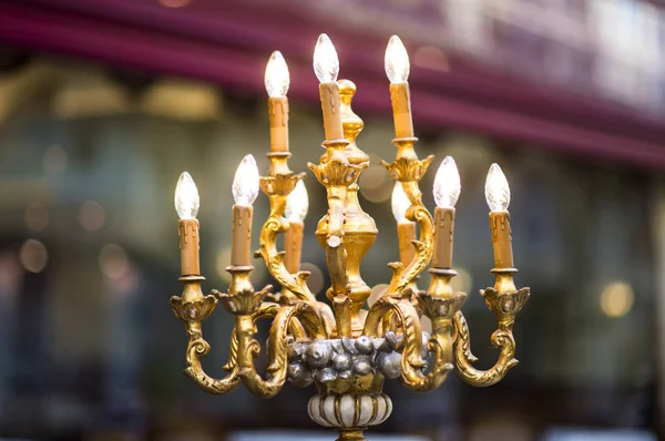 Store interior closeup golden lamp look like antique candlestick