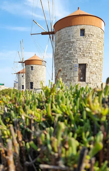 Ancient stone mills in the coast of Rhodes town in Greece