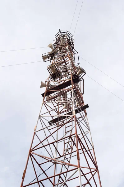 sound speaker tower with clouds sky