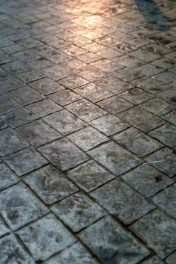 Çimento blok zemin arka planında ışık yansıması