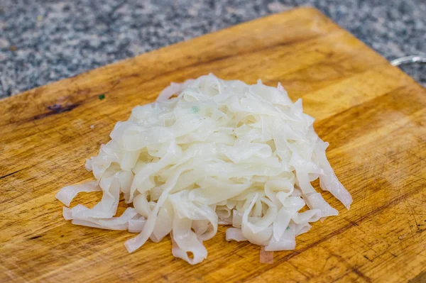 Asian noodle style on chopping block closeup — Stock Photo, Image