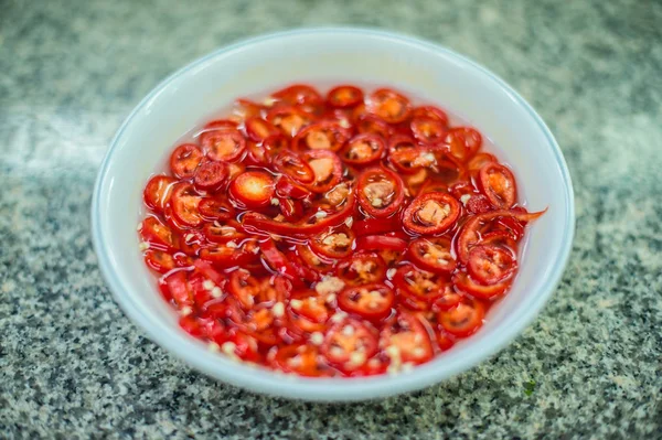 Closeup of red chili in ceramic cup — Stock Photo, Image