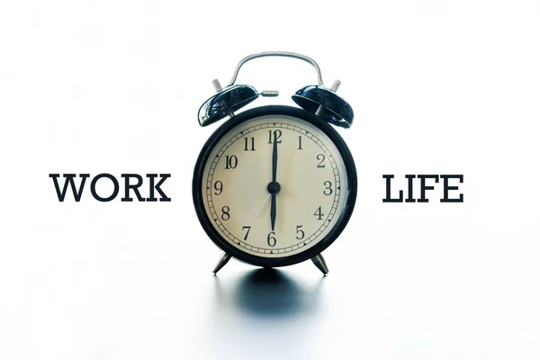 work life balance concept, alarm clock with word Work and Life